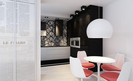 Na jednej ze ścian architektki zaproponowały czarno-białe wydruki z gazet.