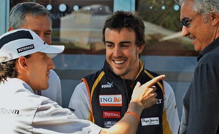 Robert Kubica, dwukrotny mistrz świata Fernando Alonso (w środku) i szef Renault Flavio Briatore