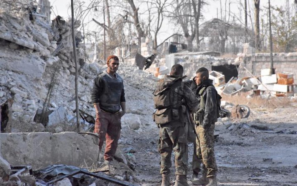 Prorządowe syryjskie oddziały we wschodnim Aleppo. Tę część miasta pomogli Baszarowi Asadowi odbić I