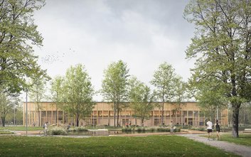 Budynek hali z elewacją w nturalnych kolorach ma łatwo się wkopmonować w zieleń Pola Mokotowskiego