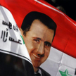 Flaga Syrii z wizerunkiem prezydenta Baszara Asada