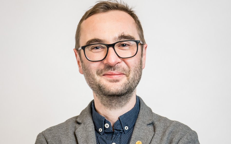 dr Michał Możdżeń z Uniwersytetu Ekonomicznego w Krakowie