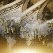 Taniejący dolar namiesza w wynikach przedsiębiorstw