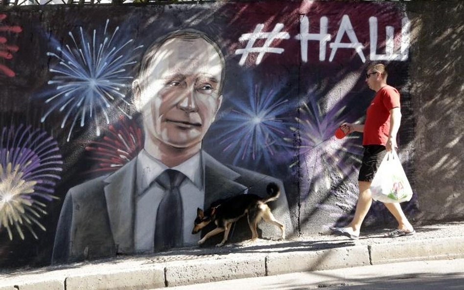 Graffiti z wizerunkiem Władimira Putina na jednym z murów w Jałcie