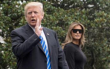 Donald Trump z żoną Melanią w ogrodach Białego Domu tuż przed odlotem do Polski