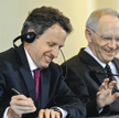 Amerykański sekretarz skarbu Timothy Geithner (z lewej) namawiał na wrz eśniowym spotkaniu Ecofinu w
