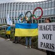 Protest przeciwko udziałowi Rosjan w igrzyskach w Paryżu przed siedzibą MKOl w Lozannie