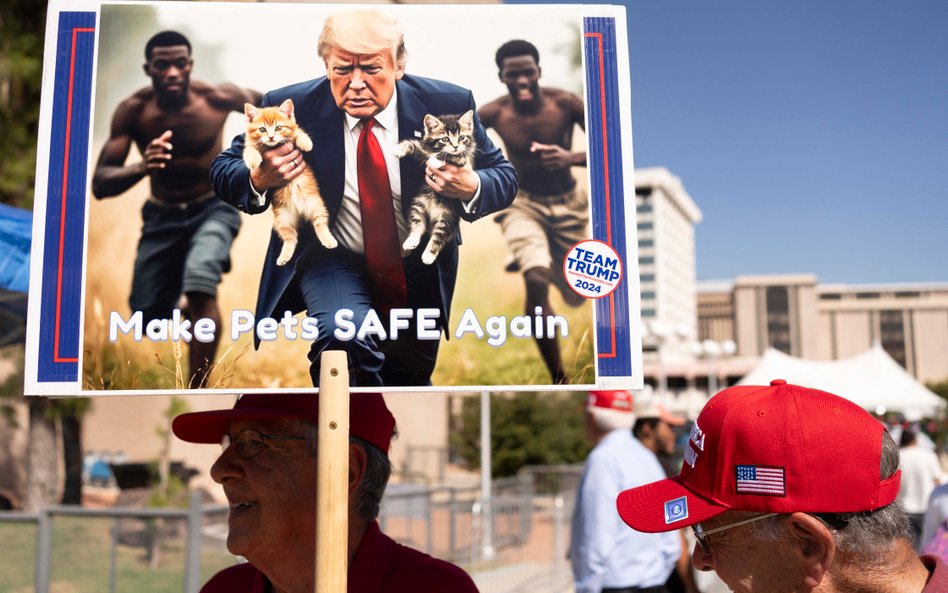 Mężczyzna niesie wygenerowany przez sztuczną inteligencję obraz przedstawiający prezydenta USA Donal