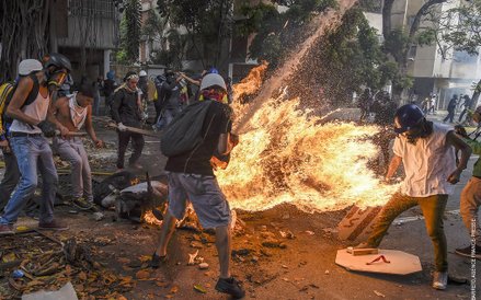 Juan Barreto, "Demonstrator Catches Fire"