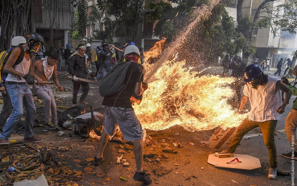 Juan Barreto, "Demonstrator Catches Fire"