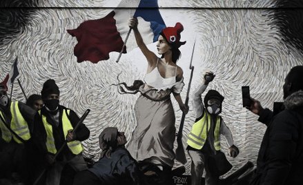 Wolność wiodąca "żółte kamizelki" na barykady” - paryski mural artysty, podpisującego się "PBOY", in