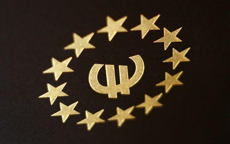 Symbol euro wpisany w unijne gwiazdki