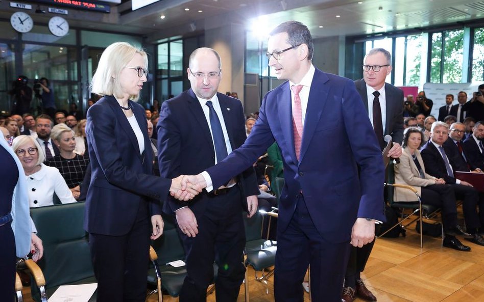 Nz. od lewej: Teresa Czerwińska, minister finansów, Jacek Fotek, wiceprezes zarządu GPW, Mateusz Mor