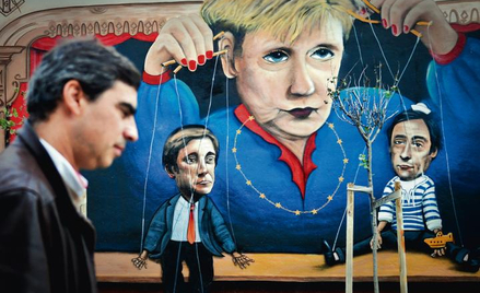 Grafitti na lizbońskiej ulicy. Premier Pedro Coelho i szef dyplomacji Paulo Portas zatańczą jak Ange