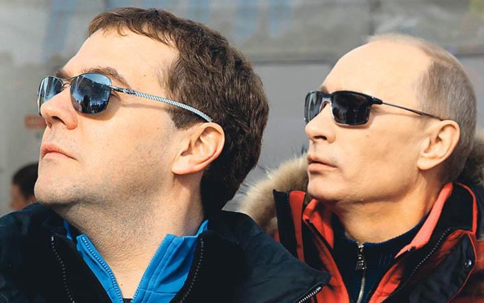 Russian President Dmitry Medvedev (L) and Prime Minister Vladimir Putin visit the newly built Rosa K