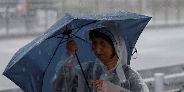 Tropical storm Jangmi hits Japan, leaving thousands without power and flights canceled