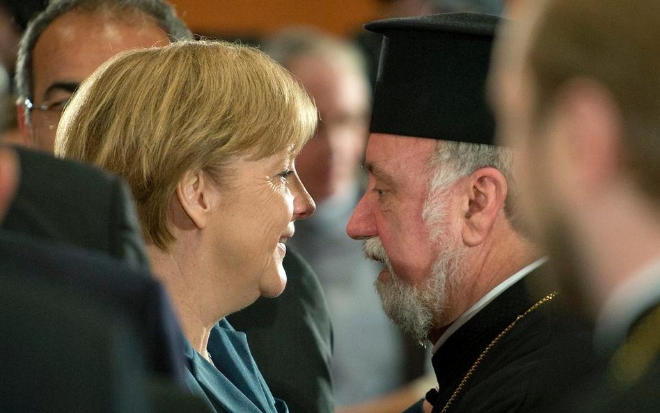 Kanclerz Merkel ze zwierzchnikiem greckiego Kościoła prawosławnego Apostolosem Malamoussisem w czasi