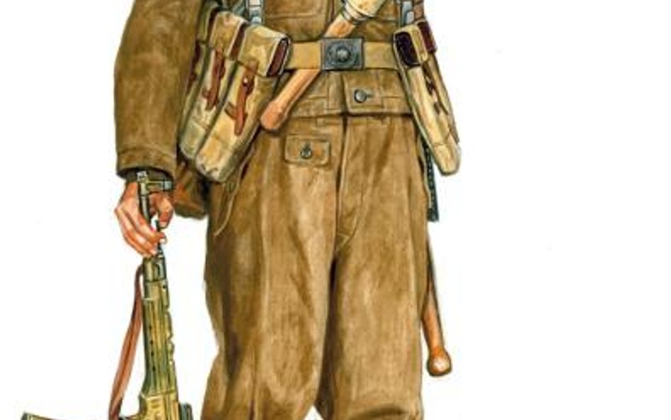 Żołnierz niemiecki w battledresie uzbrojony w karabin szturmowy MP43 (StG 44)