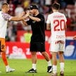Bramkarz Górnika Zabrze Tomasz Loska (L) i właściciel klubu Lukas Podolski (2L) cieszą się ze zwycię