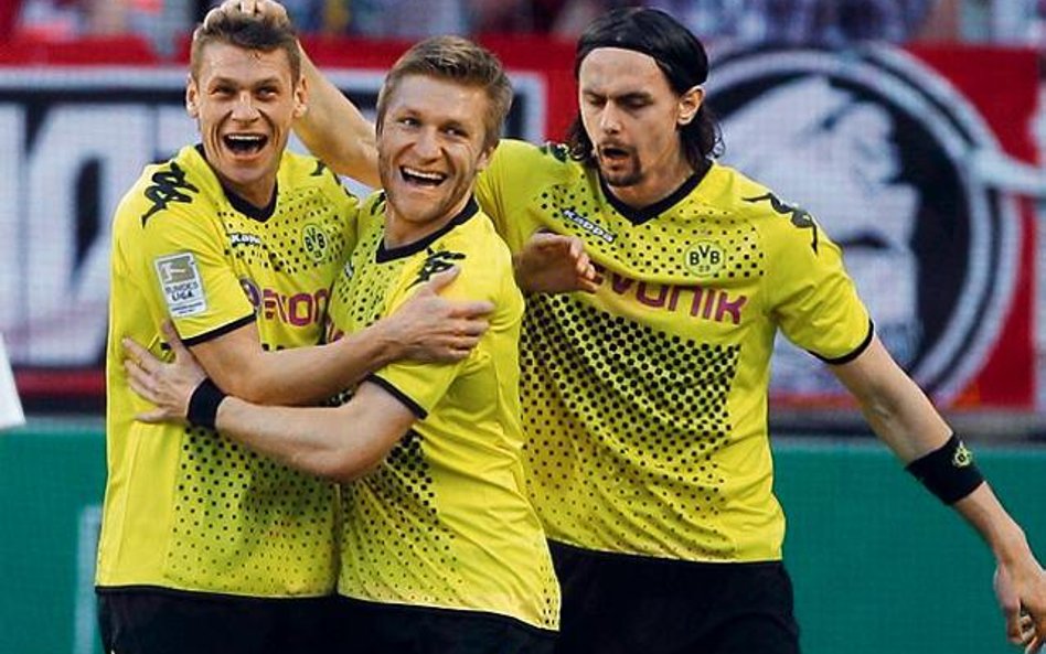 Kuba Błaszczykowski gratuluje Łukaszowi Piszczkowi bramki