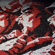 Żywy obraz utworzony przez widownię zgromadzoną na stadionie w Phenianie podczas jednej z licznych o